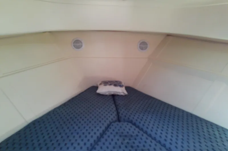 Dolce Far Niente Yacht Photos Pics 2004 Mainship 34 Pilot II cabin interior with cozy bedding and pillow.
