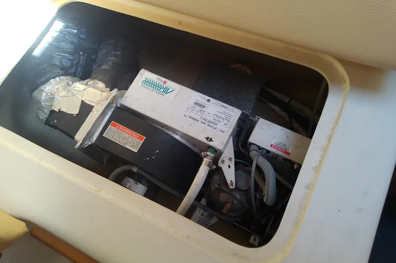 Dolce Far Niente Yacht Photos Pics 2004 Mainship 34 Pilot II engine compartment with wiring and components.