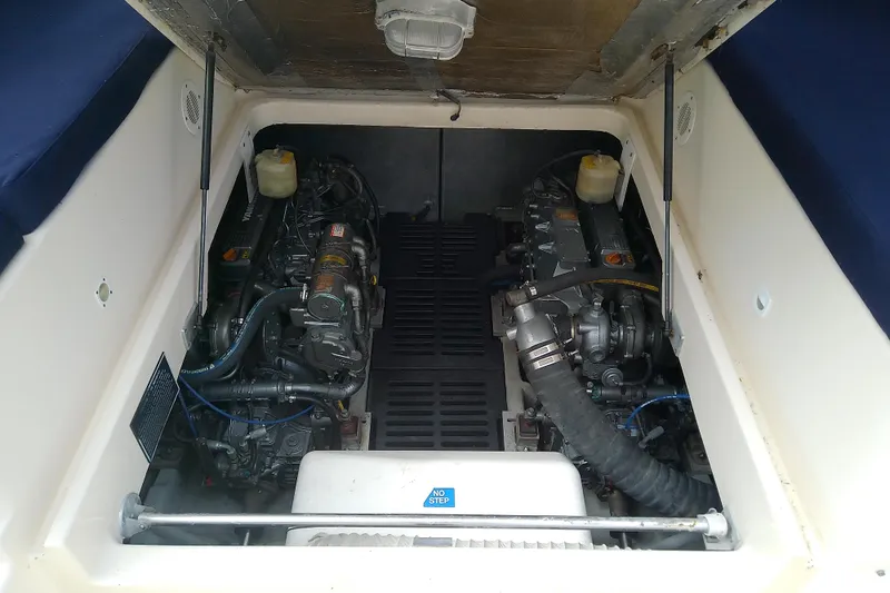 Dolce Far Niente Yacht Photos Pics Engine compartment of 2004 Mainship 34 Pilot II boat, showcasing dual engines.