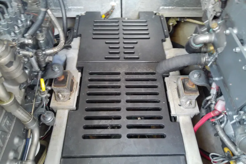 Dolce Far Niente Yacht Photos Pics Engine compartment of a 2004 Mainship 34 Pilot II boat, showing mechanical components.