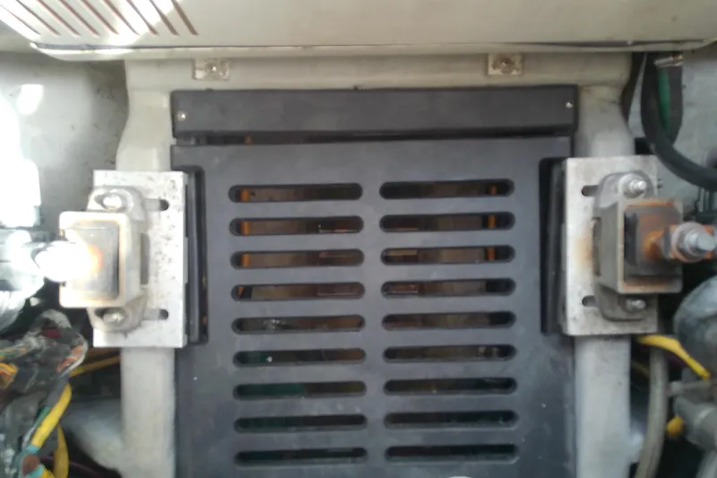 Dolce Far Niente Yacht Photos Pics Engine compartment of 2004 Mainship 34 Pilot II boat, showing mechanical components and wiring.