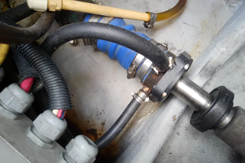 Dolce Far Niente Yacht Photos Pics Engine compartment of 2004 Mainship 34 Pilot II with hoses and fittings.