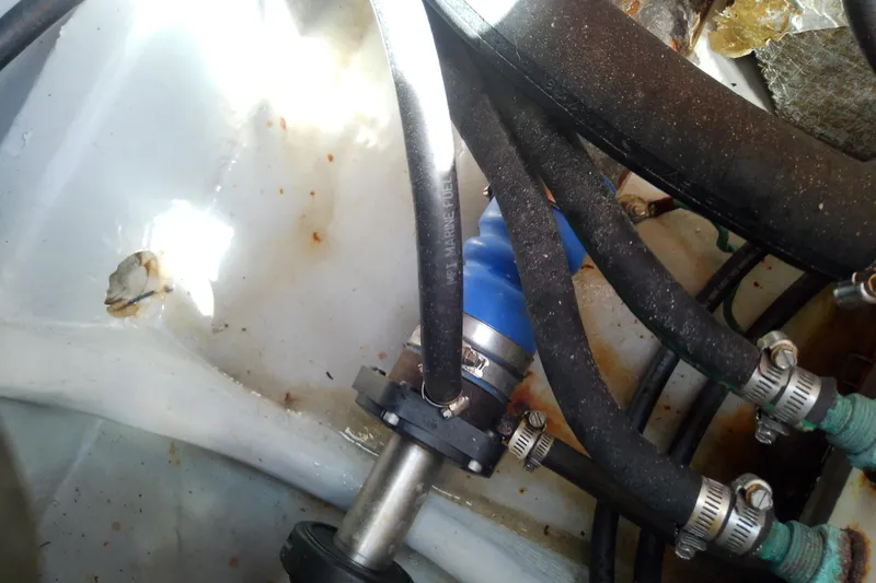 Dolce Far Niente Yacht Photos Pics Engine compartment of 2004 Mainship 34 Pilot II with hoses and clamps.