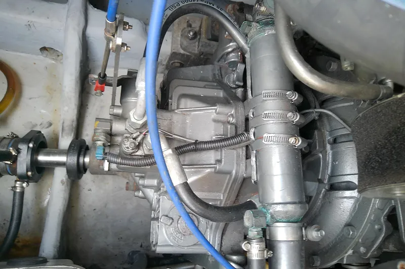 Dolce Far Niente Yacht Photos Pics Engine compartment of a 2004 Mainship 34 Pilot II boat, showing mechanical components.