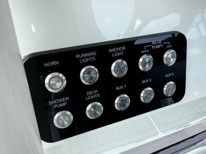  Yacht Photos Pics Control panel of a 2022 Brig Eagle 10 boat with various switches.