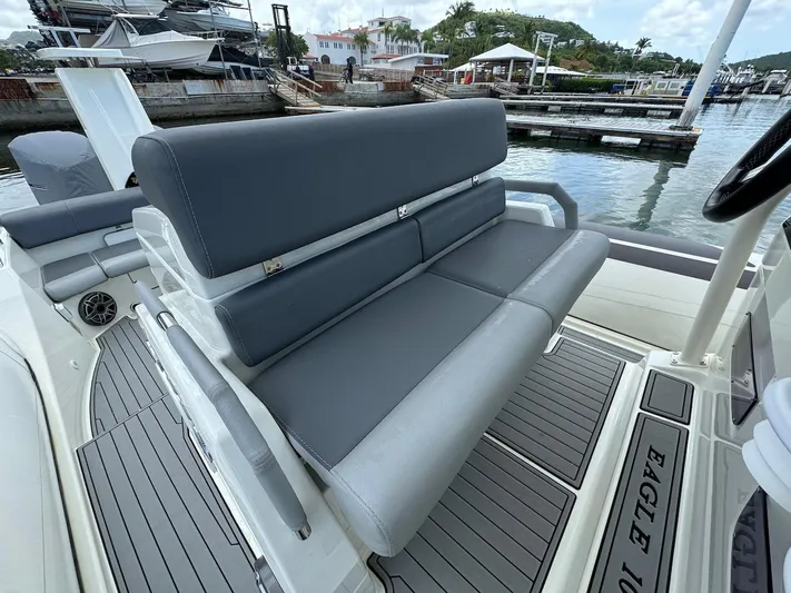  Yacht Photos Pics 2022 Brig Eagle 10 boat with gray seating at a marina.