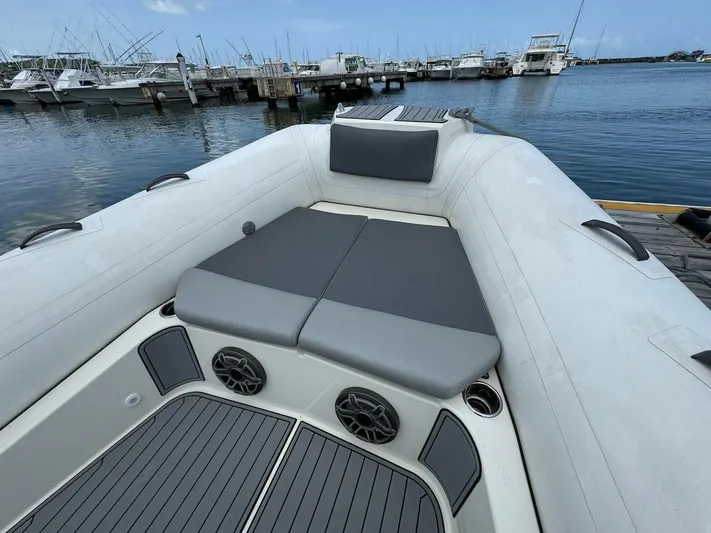  Yacht Photos Pics 2022 Brig Eagle 10 inflatable boat at marina with cushioned seating.