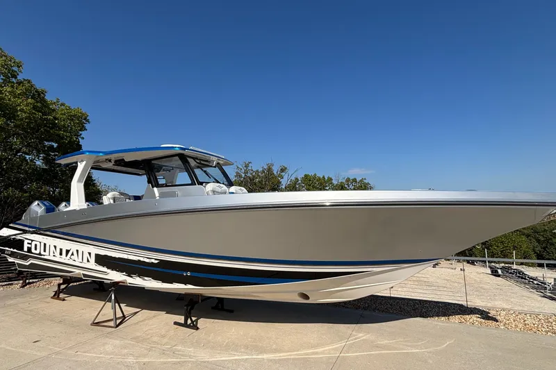  Yacht Photos Pics 2024 Fountain 38 SCX boat on display, sleek design under clear blue sky.