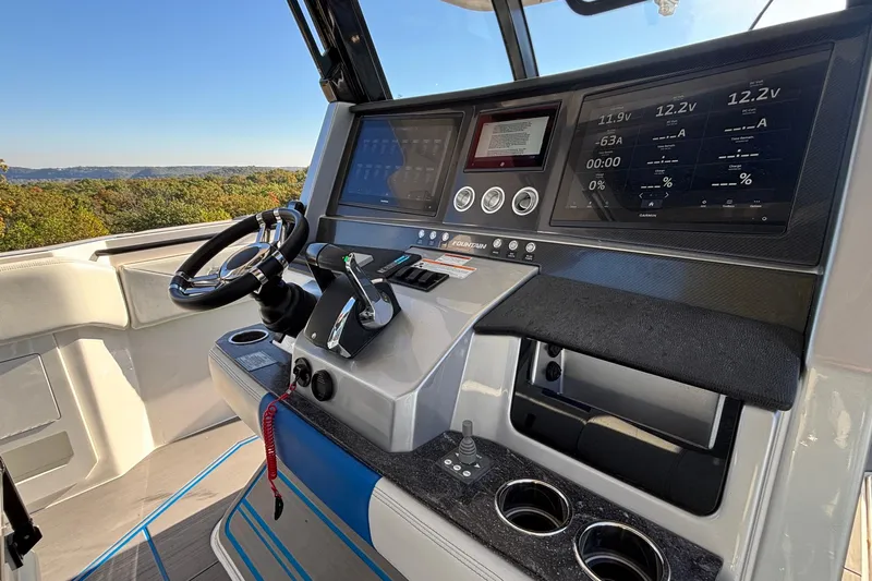  Yacht Photos Pics 2024 Fountain 38 SCX boat dashboard with advanced controls and digital displays.