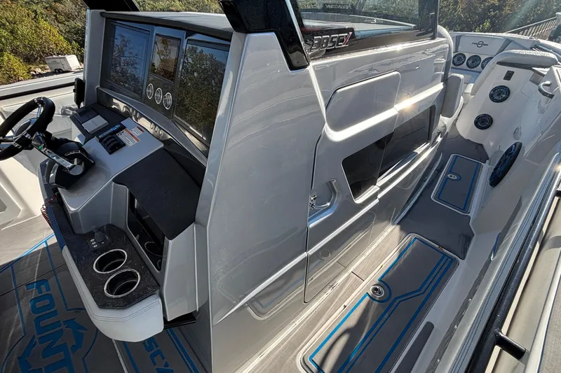 Yacht Photos Pics 2024 Fountain 38 SCX boat cockpit with modern controls and sleek design.