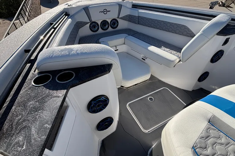  Yacht Photos Pics 2024 Fountain 38 SCX boat interior with seating, cup holders, and speakers.