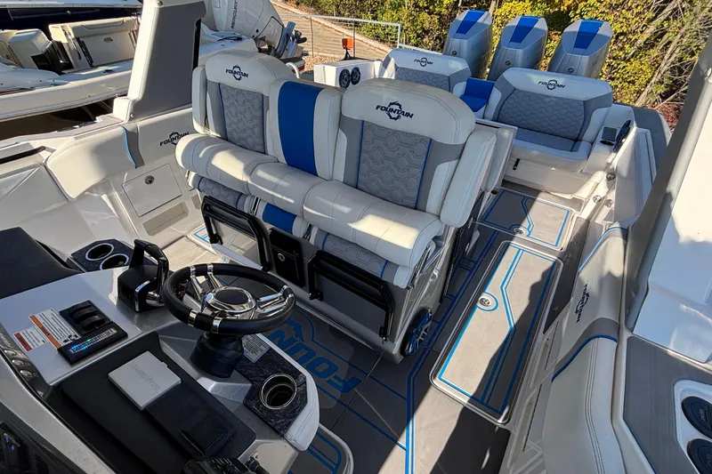  Yacht Photos Pics 2024 Fountain 38 SCX boat interior with luxurious seating and modern steering console.