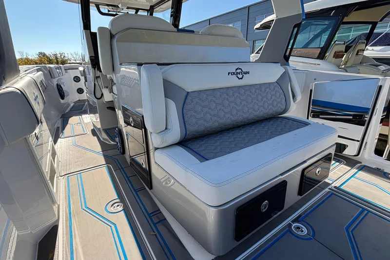  Yacht Photos Pics 2024 Fountain 38 SCX boat interior with stylish seating and modern design.