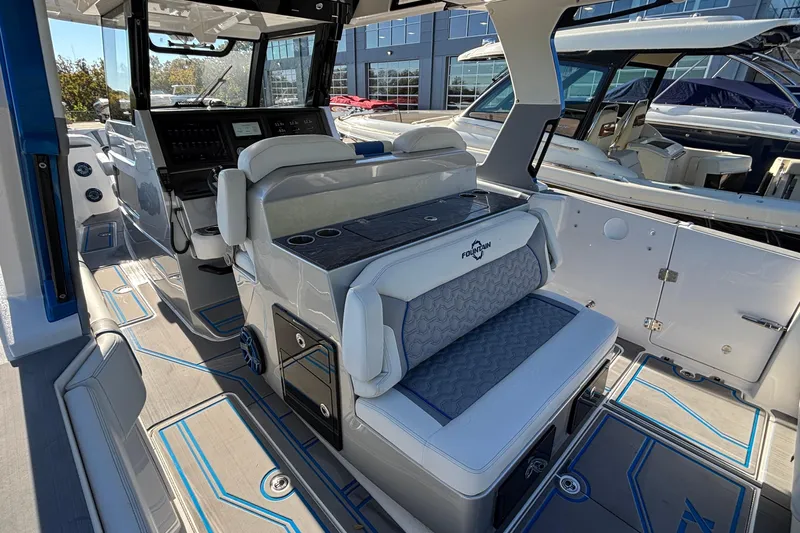 Yacht Photos Pics 2024 Fountain 38 SCX boat interior with modern seating and control panel.