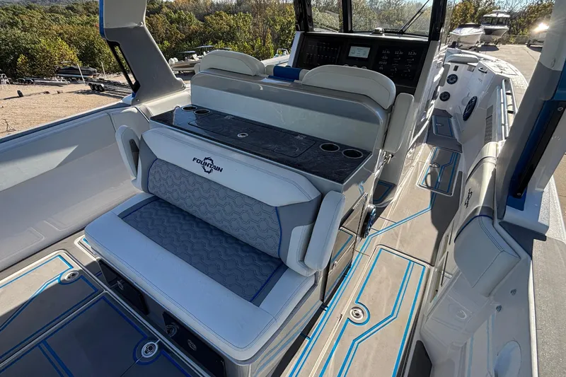  Yacht Photos Pics 2024 Fountain 38 SCX boat interior with modern seating and control panel.