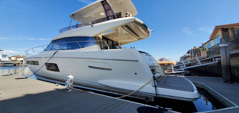 " La Bella Vita" Yacht Photos Pics Prestige 560 Flybridge yacht, 2017 model, docked at a marina under clear blue skies.