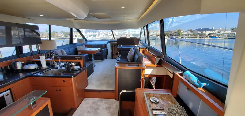 " La Bella Vita" Yacht Photos Pics Luxurious interior of a 2017 Prestige 560 Flybridge yacht with modern amenities.