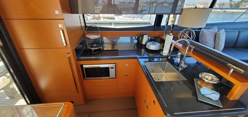 " La Bella Vita" Yacht Photos Pics Luxurious kitchen interior of 2017 Prestige 560 Flybridge yacht with modern amenities.