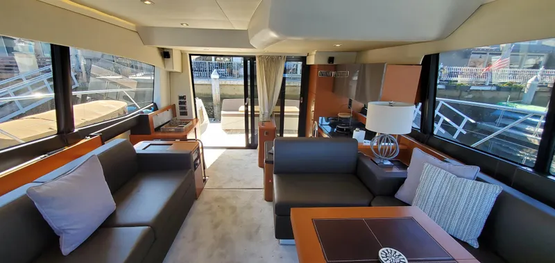 " La Bella Vita" Yacht Photos Pics Luxurious interior of a 2017 Prestige 560 Flybridge yacht with elegant seating and decor.