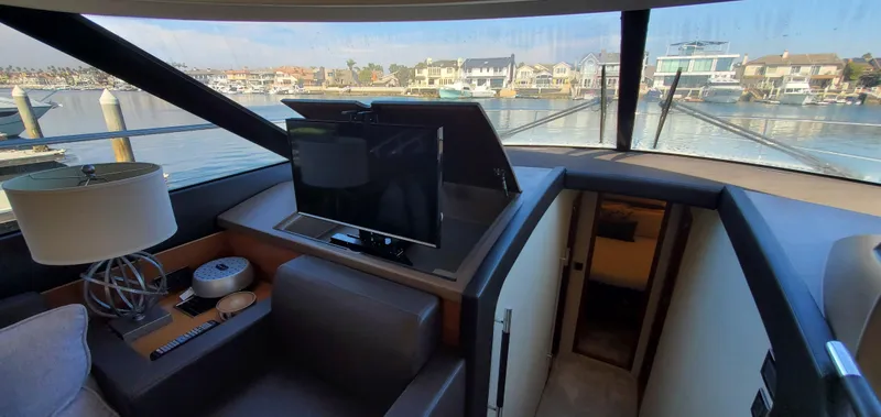 " La Bella Vita" Yacht Photos Pics Interior of 2017 Prestige 560 Flybridge yacht with scenic waterfront view.