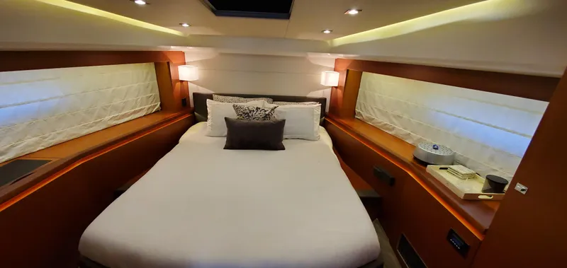 " La Bella Vita" Yacht Photos Pics Luxurious bedroom interior of 2017 Prestige 560 Flybridge yacht with elegant lighting.