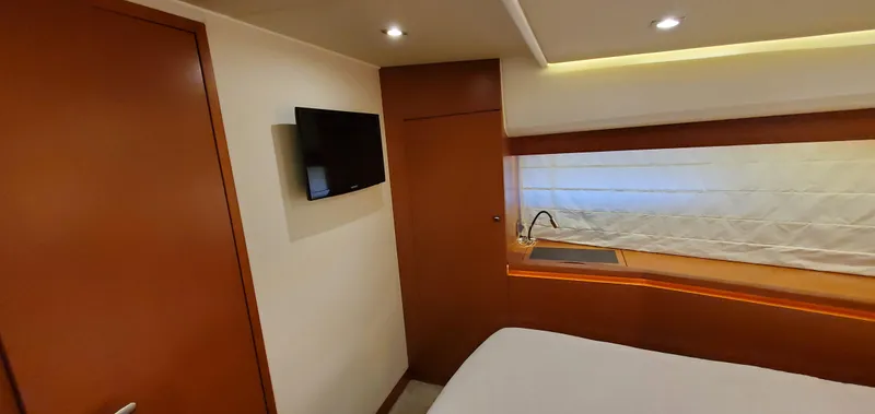 " La Bella Vita" Yacht Photos Pics Interior of 2017 Prestige 560 Flybridge yacht with TV and window.