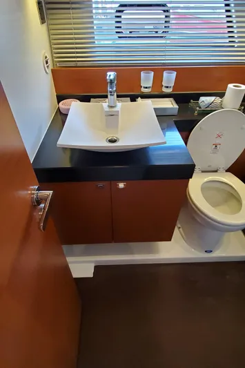 " La Bella Vita" Yacht Photos Pics Bathroom interior of a 2017 Prestige 560 Flybridge yacht with modern fixtures.