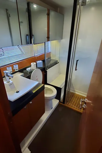 " La Bella Vita" Yacht Photos Pics Luxurious bathroom in 2017 Prestige 560 Flybridge yacht with modern fixtures and sleek design.