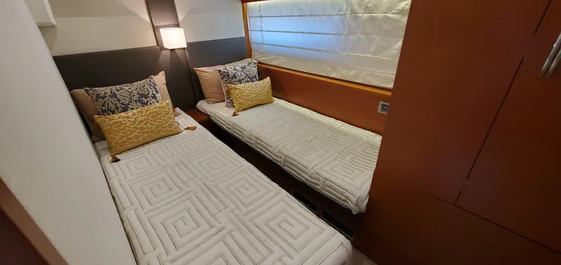 " La Bella Vita" Yacht Photos Pics Twin cabin with modern decor in a 2017 Prestige 560 Flybridge yacht.