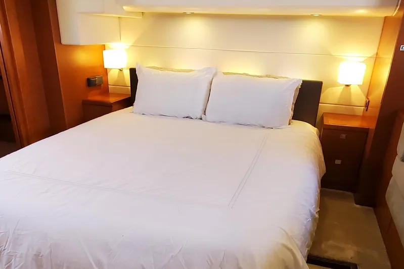 " La Bella Vita" Yacht Photos Pics Luxurious bedroom interior of 2017 Prestige 560 Flybridge yacht with elegant lighting.