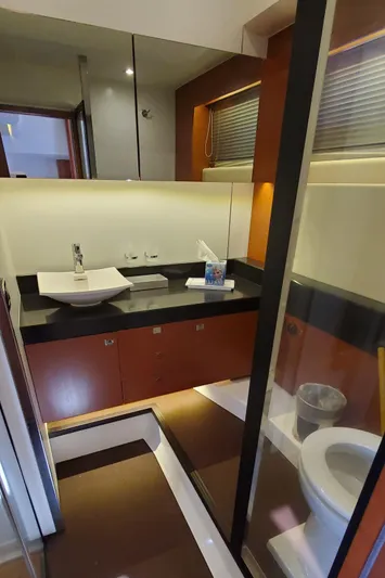 " La Bella Vita" Yacht Photos Pics Luxurious bathroom in 2017 Prestige 560 Flybridge yacht with modern fixtures and elegant design.