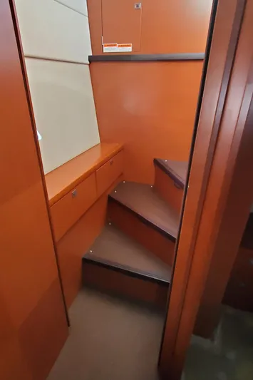 " La Bella Vita" Yacht Photos Pics Staircase inside 2017 Prestige 560 Flybridge yacht with wooden finish.