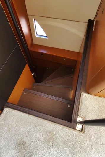 " La Bella Vita" Yacht Photos Pics Staircase inside 2017 Prestige 560 Flybridge yacht, featuring wooden steps and modern design.