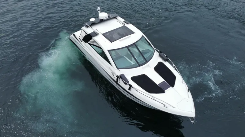  Yacht Photos Pics 2016 Cobalt A40 boat cruising on open water, aerial view.