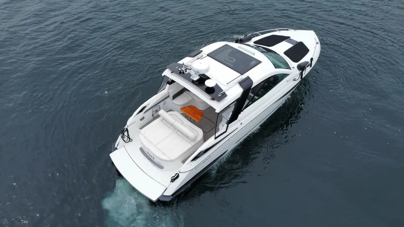  Yacht Photos Pics 2016 Cobalt A40 boat cruising on open water, aerial view.