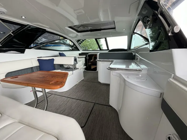  Yacht Photos Pics Luxurious interior of a 2016 Cobalt A40 boat with modern seating and wooden table.