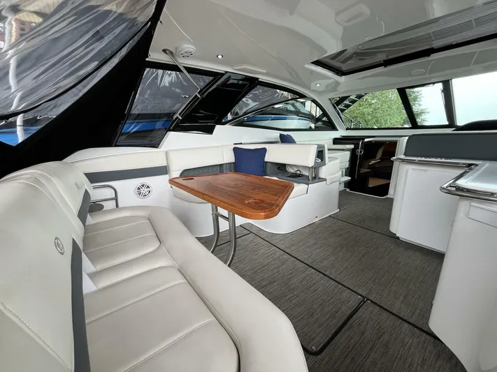  Yacht Photos Pics Luxurious interior of a 2016 Cobalt A40 boat with elegant seating and wooden table.