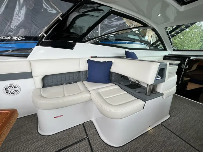  Yacht Photos Pics Luxurious interior of 2016 Cobalt A40 boat with white seating and blue accents.