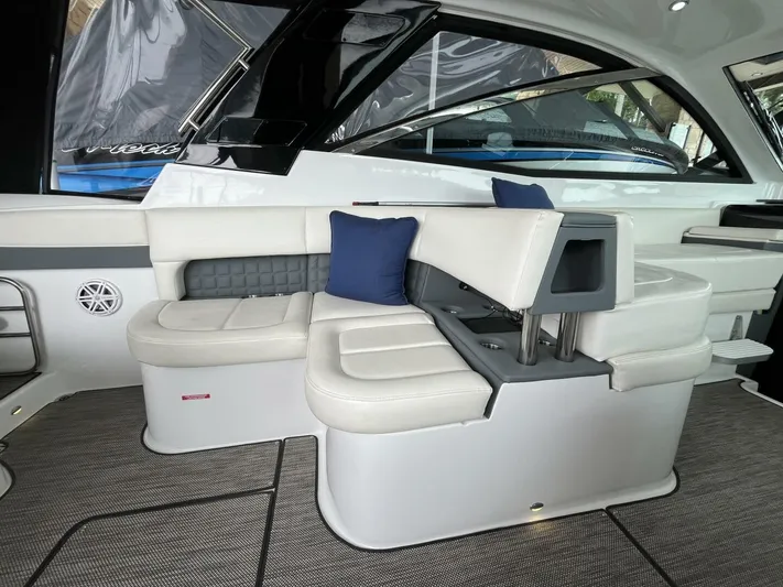  Yacht Photos Pics 2016 Cobalt A40 boat interior with white seating and blue cushions.
