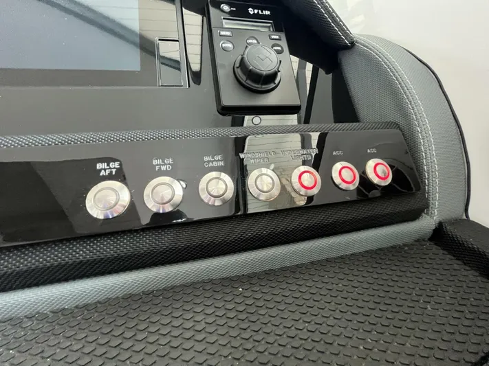  Yacht Photos Pics Control panel of a 2016 Cobalt A40 boat with various switches and buttons.