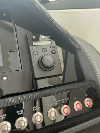  Yacht Photos Pics Control panel of a 2016 Cobalt A40 boat with FLIR system and various switches.