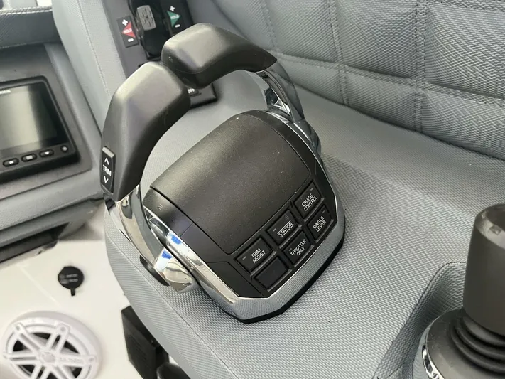  Yacht Photos Pics Control panel of a 2016 Cobalt A40 boat with throttle and buttons.