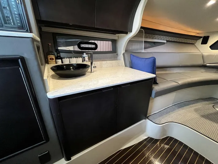  Yacht Photos Pics Interior of 2016 Cobalt A40 yacht with kitchenette and seating area.