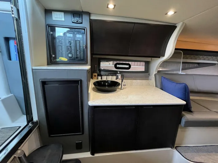  Yacht Photos Pics 2016 Cobalt A40 yacht interior with modern kitchenette and seating area.
