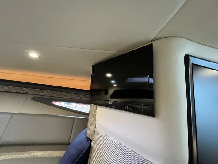  Yacht Photos Pics Interior of a 2016 Cobalt A40 boat featuring a mounted flat-screen TV.