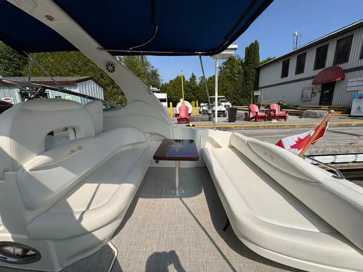  Yacht Photos Pics 2002 Sea Ray 360 Sundancer boat interior with white seating and Canadian flag.