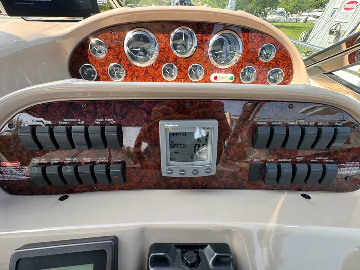  Yacht Photos Pics Control panel of a 2002 Sea Ray 360 Sundancer boat with gauges and switches.
