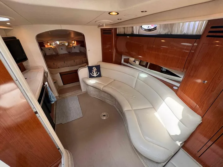  Yacht Photos Pics Interior of 2002 Sea Ray 360 Sundancer yacht with elegant seating and cozy cabin.