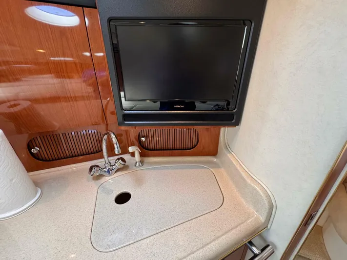  Yacht Photos Pics 2002 Sea Ray 360 Sundancer interior with sink and TV in cabin.