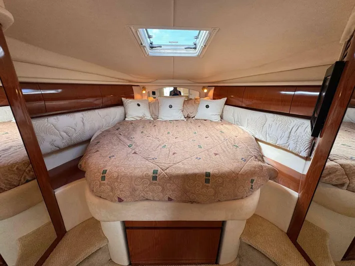  Yacht Photos Pics Luxurious cabin interior of 2002 Sea Ray 360 Sundancer yacht with plush bedding.
